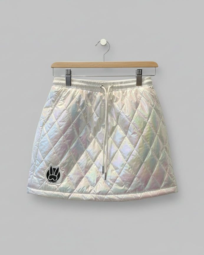 Iridescent quilted skirt with a logo on a black background