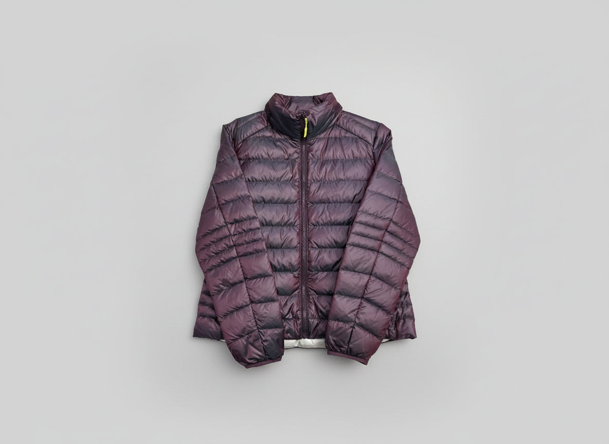 Down puffer jacket that rolls into a neck pillow for travel